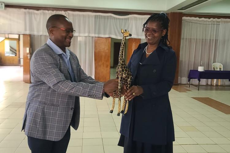 Director Mr. Gitau givving Ann a Gift 3