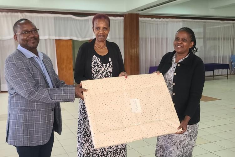 Director Mr. Gitau with Ann secretary giving Emma a Gift 1