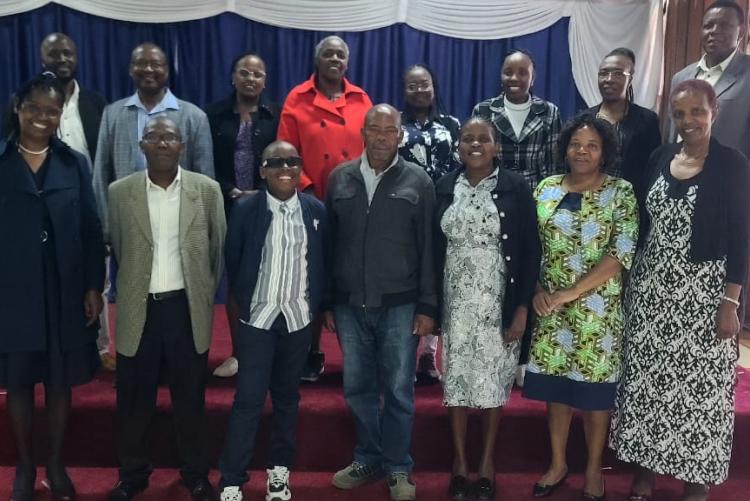 Group photo with retirees and their family