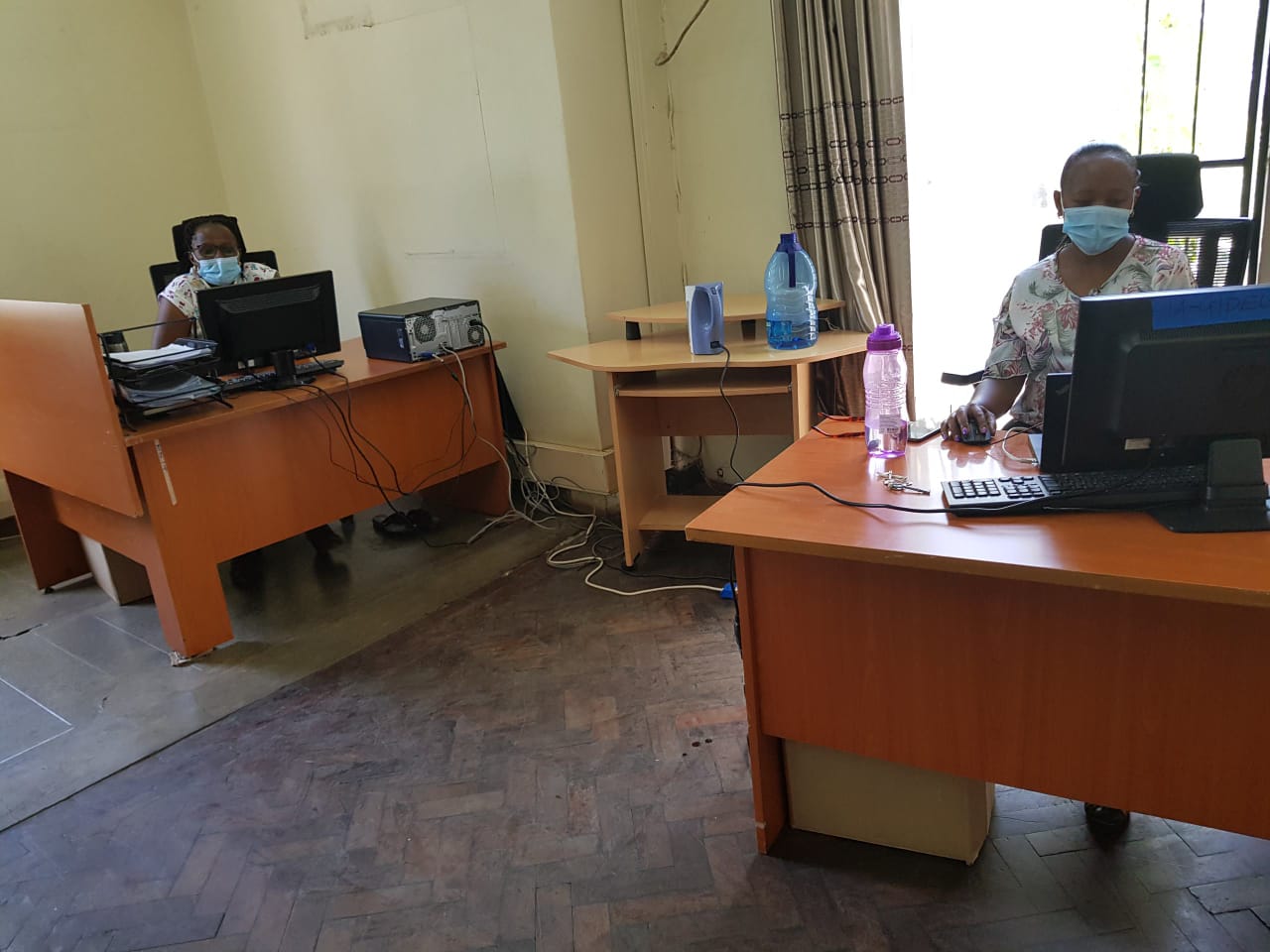 Mary Mukuha and Esther Wambua from Internal Audit office in Gandhi Wing observing social distance of 1.5 metres to prevent any risk of transmitting Corona virus 
