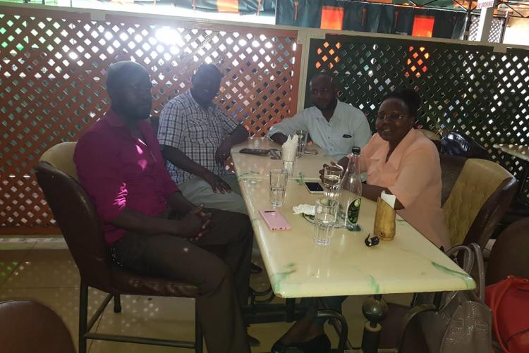 Team C having a drink with Mr. Ndirangu
