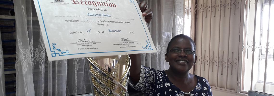 Internal Audit Secretary Displays No. 1  position Certificate of participation. Internal Audit was handed the position 1 among Central Admin Departments by the VC Prog Peter Mbithi in Taifa Hall