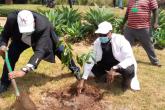 The Chief Internal Auditor Mr. Kenneth Gitau with Mr. Samuel Karanja an audit staff joins Management and Partners in Tree planting exercise in Mathai Institute
